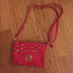 Red cross body purse with gold hardware